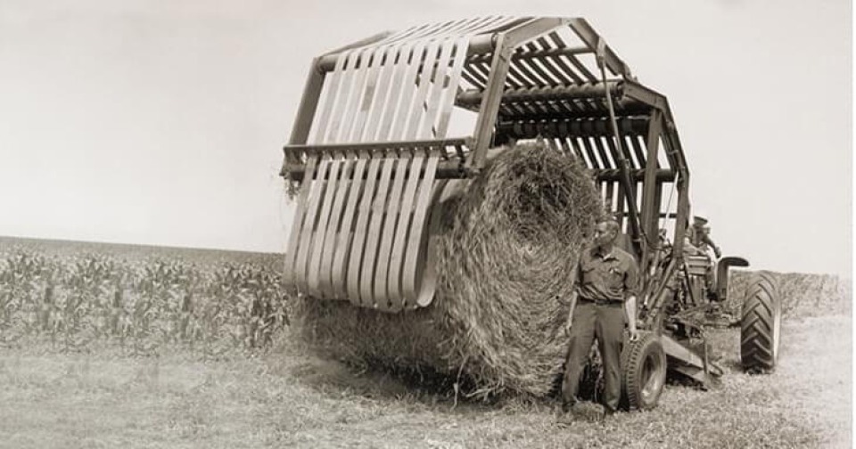 Farm worker with heavy machinery out in field